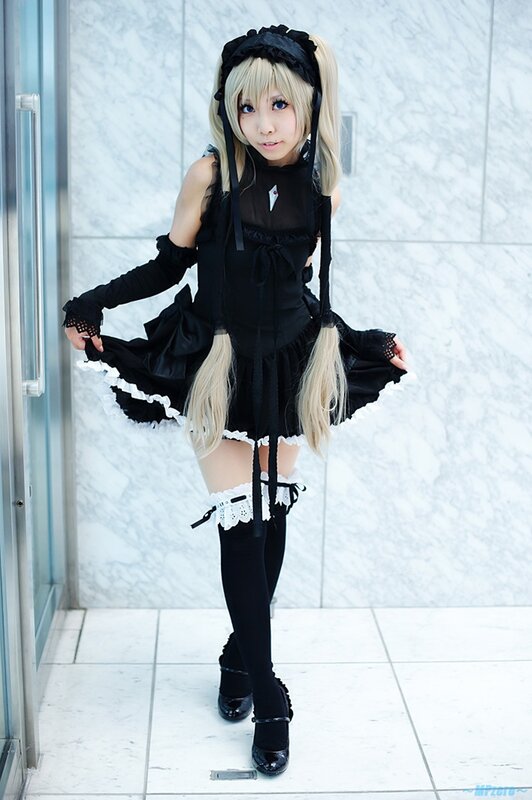 cosplayer in black maid outfit