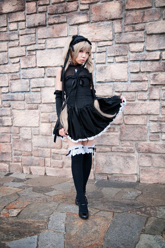 cosplayer in black maid outfit