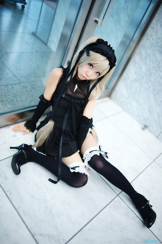 cosplayer in black maid outfit