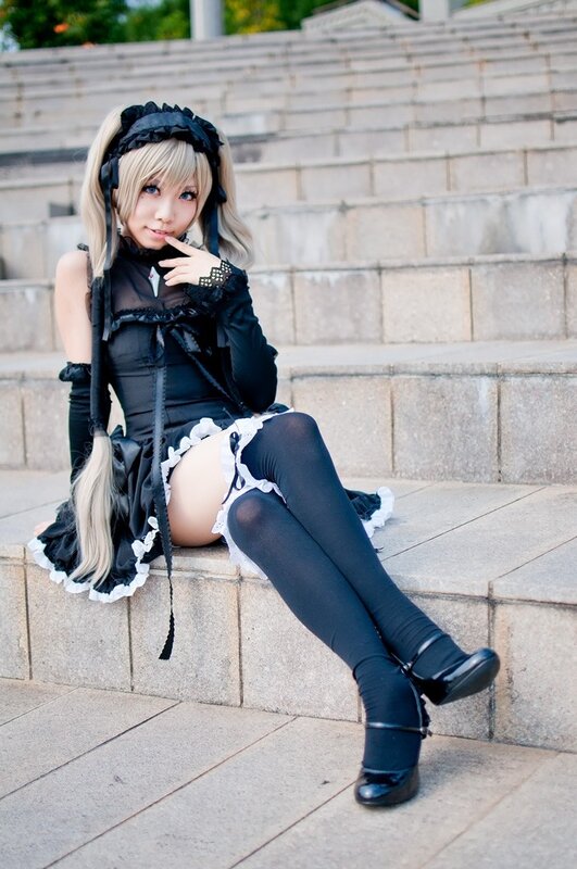 cosplayer in black maid outfit
