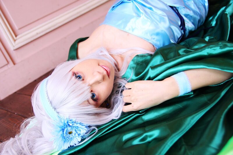 cosplayer in blue and green costume