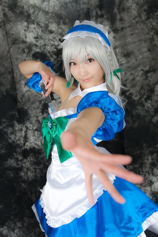 cosplayer in blue and white dress