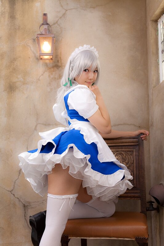 cosplayer in blue and white dress