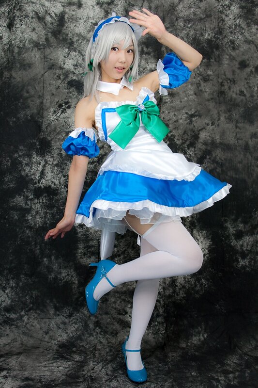 cosplayer in blue and white dress