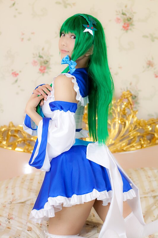 cosplayer in blue and white dress
