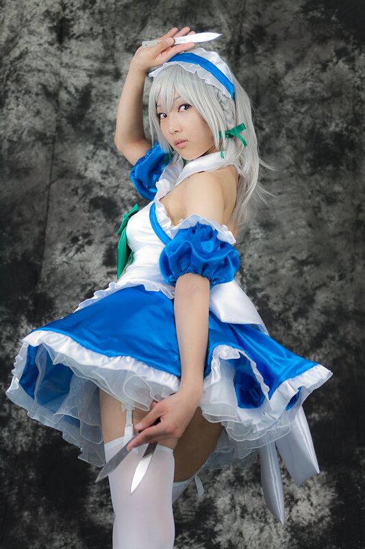 cosplayer in blue and white dress