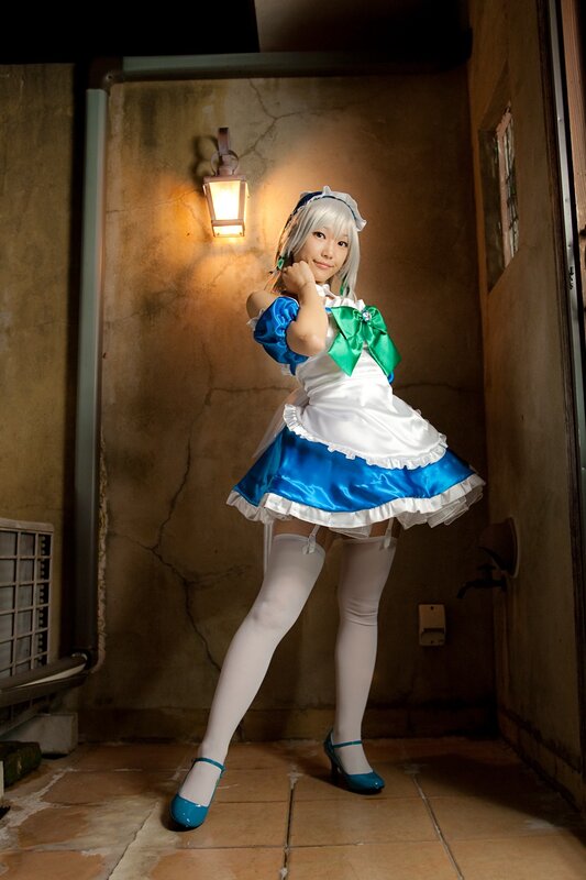 cosplayer in blue and white dress