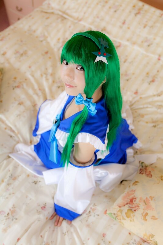 cosplayer in blue and white dress