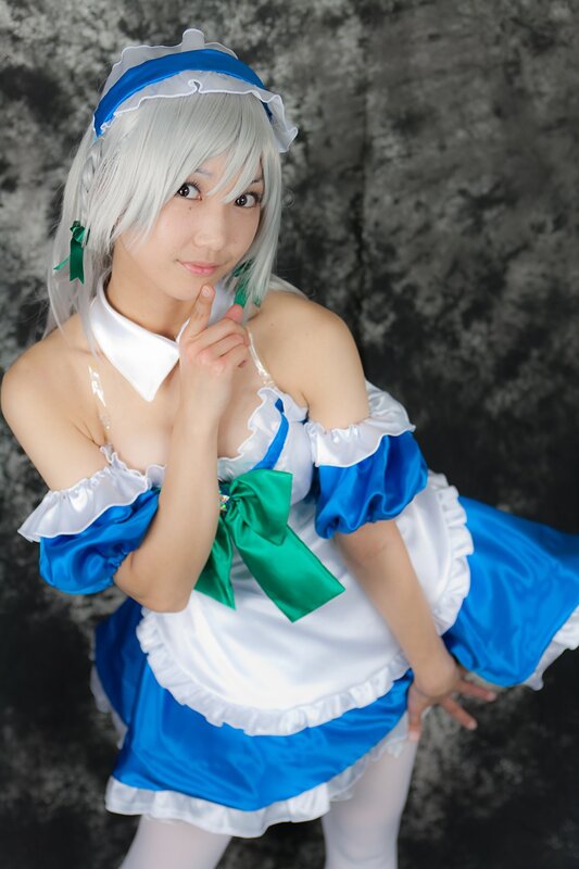 cosplayer in blue and white maid outfit