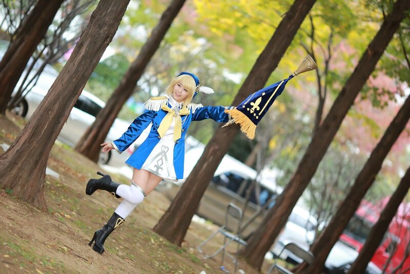 cosplayer in blue costume outdoors