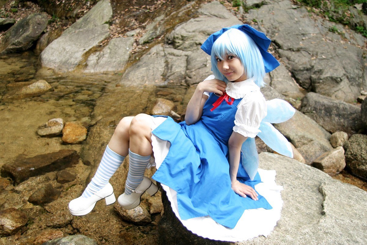 cosplayer in blue dress by stream