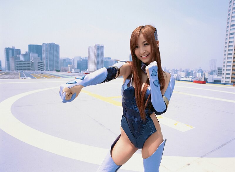 cosplayer in blue suit on rooftop