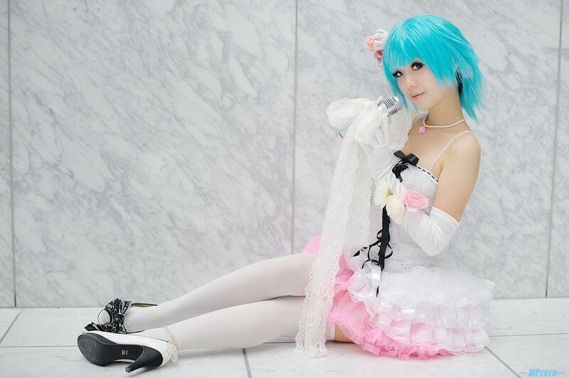 cosplayer in blue wig and dress