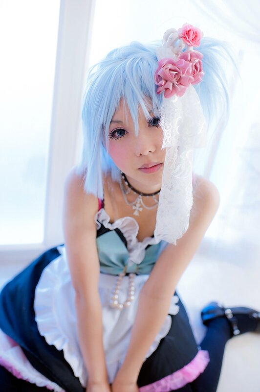 cosplayer in blue wig and dress
