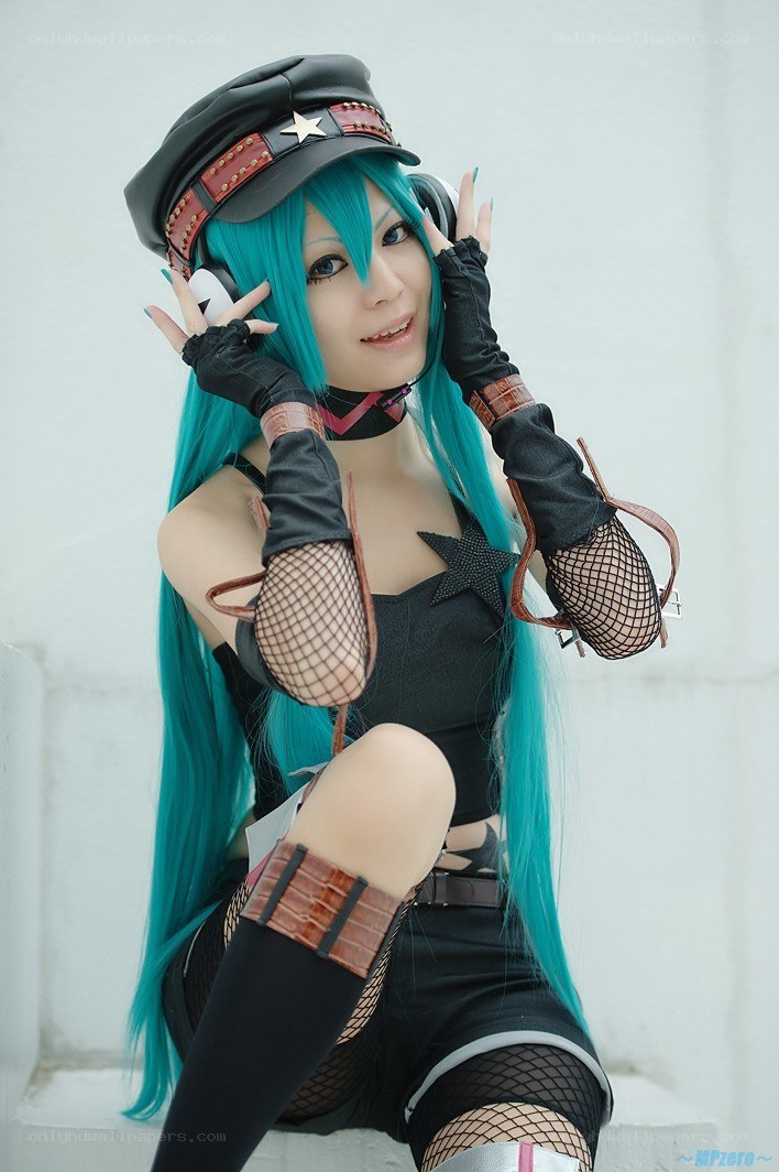 cosplayer in blue wig and hat