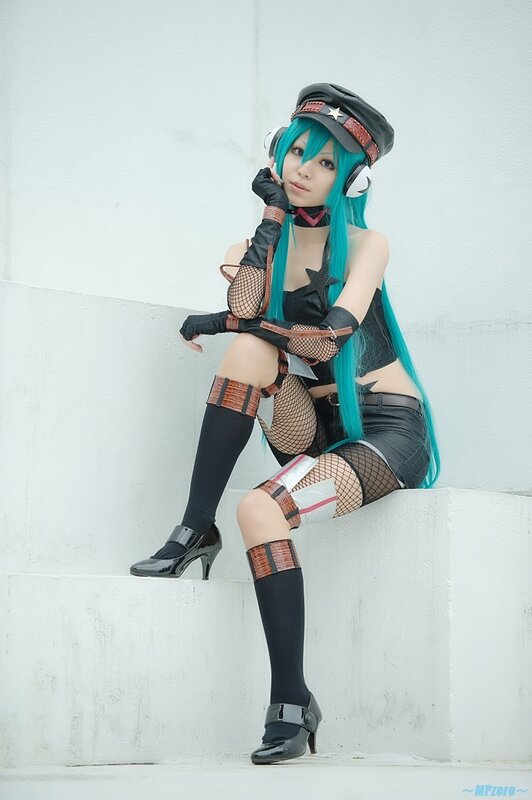 cosplayer in blue wig and headphones