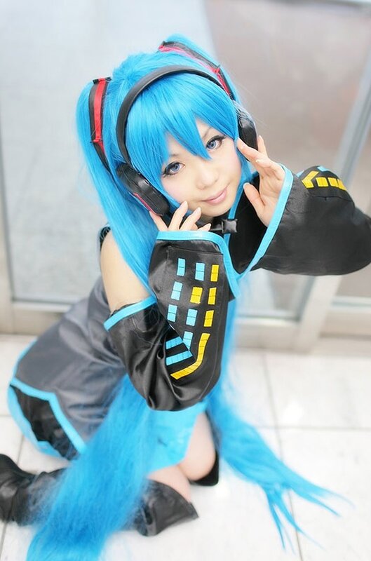 cosplayer in blue wig and headphones