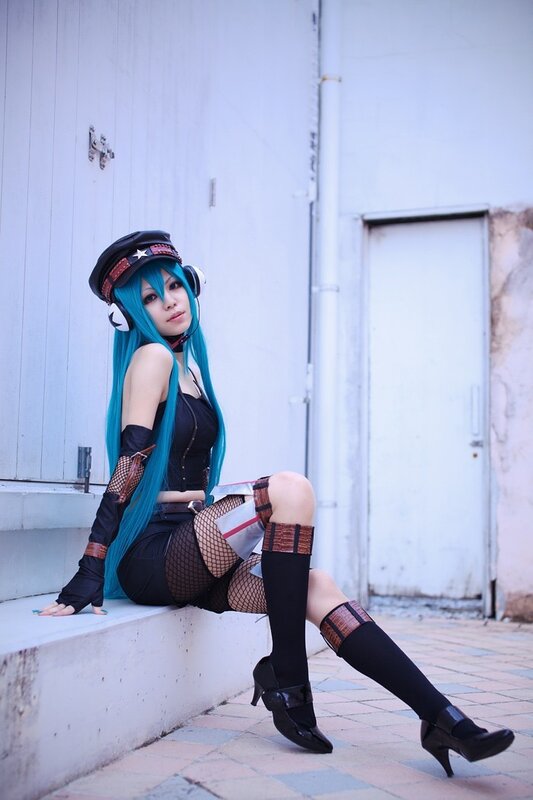 cosplayer in blue wig and headphones