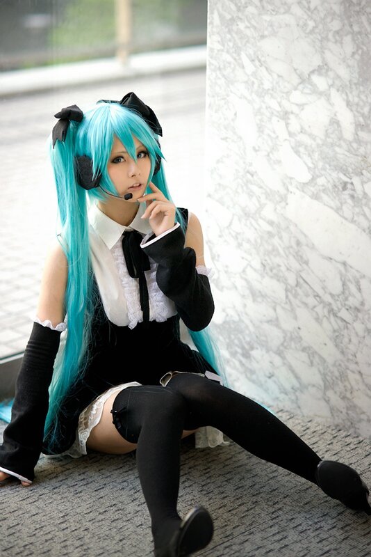cosplayer in blue wig and headset