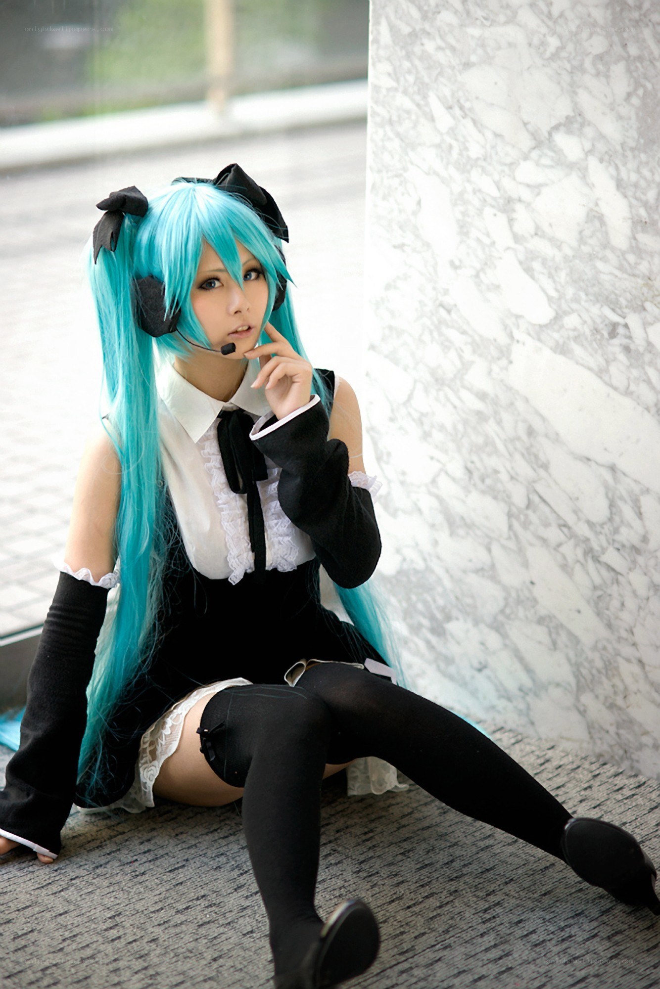 cosplayer in blue wig and headset