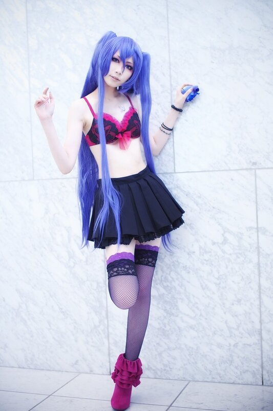 cosplayer in blue wig and school uniform