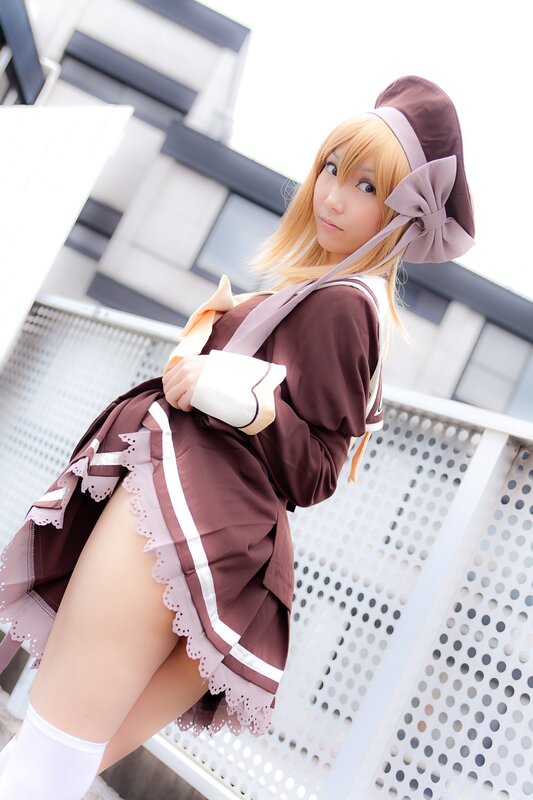 cosplayer in brown maid outfit