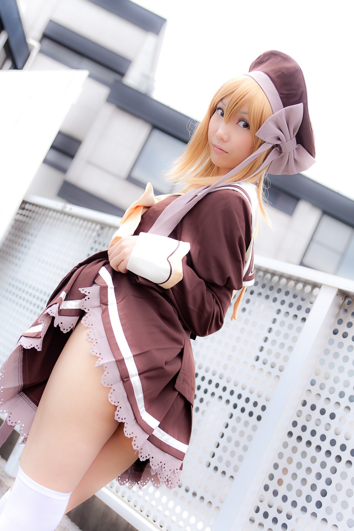 cosplayer in brown maid outfit
