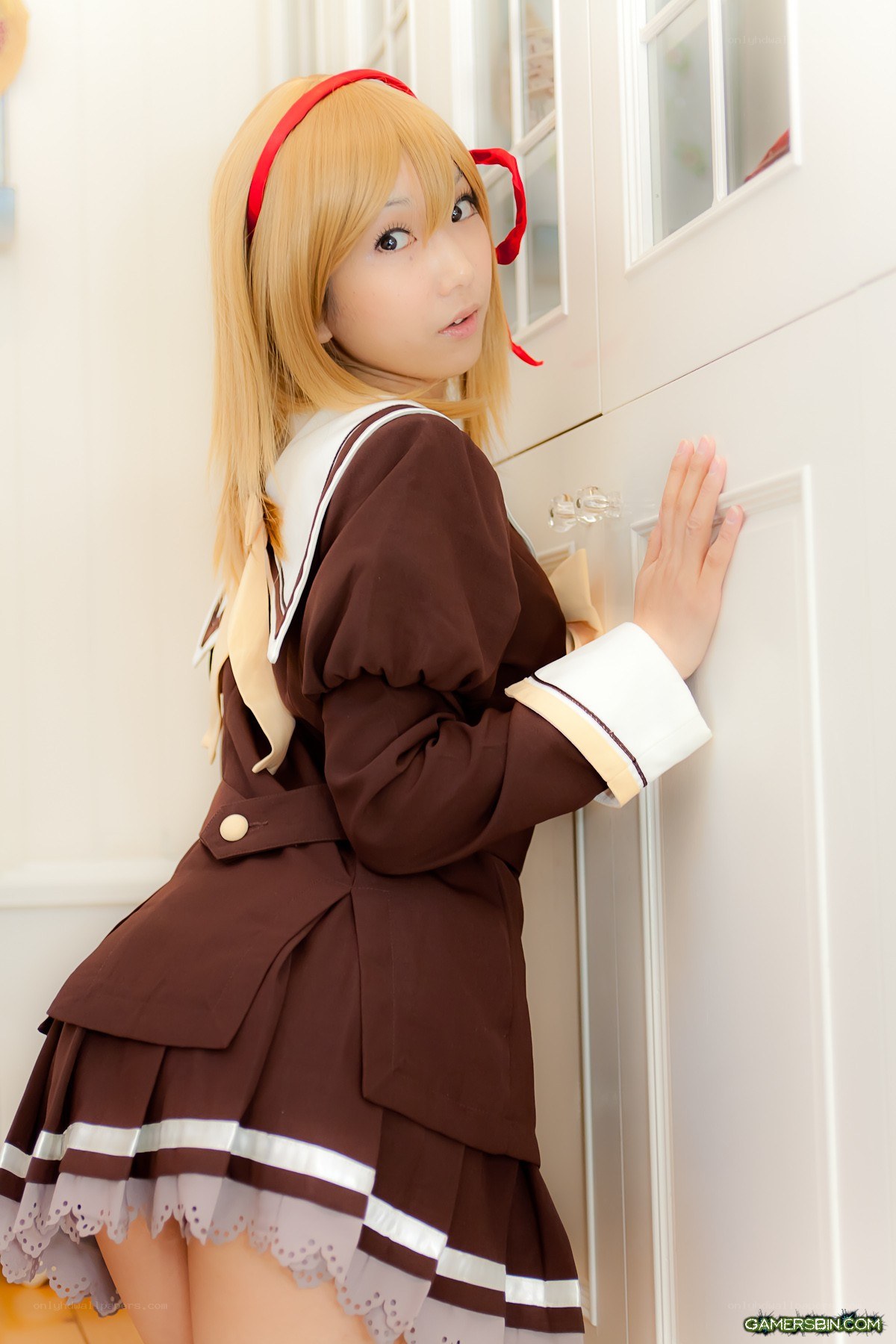 cosplayer in brown school uniform