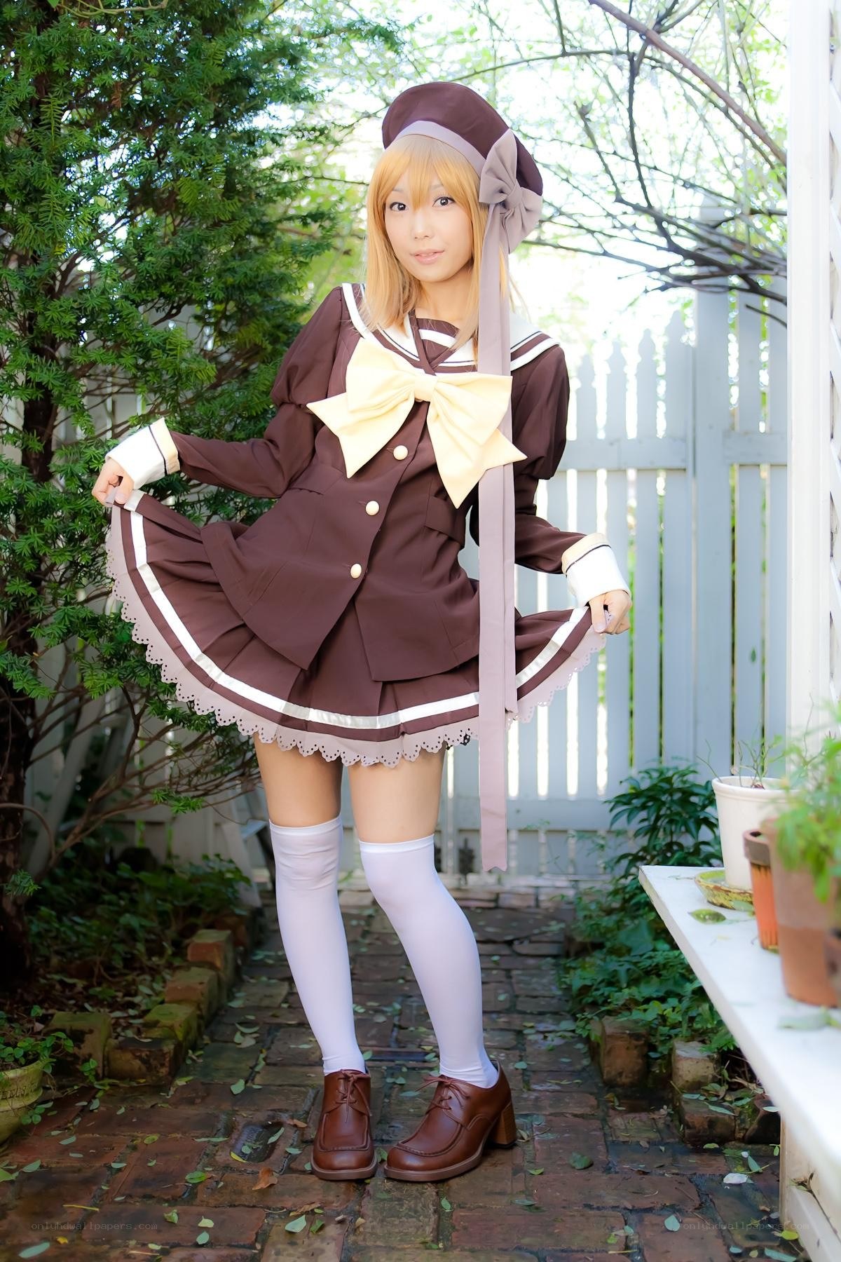 cosplayer in brown school uniform