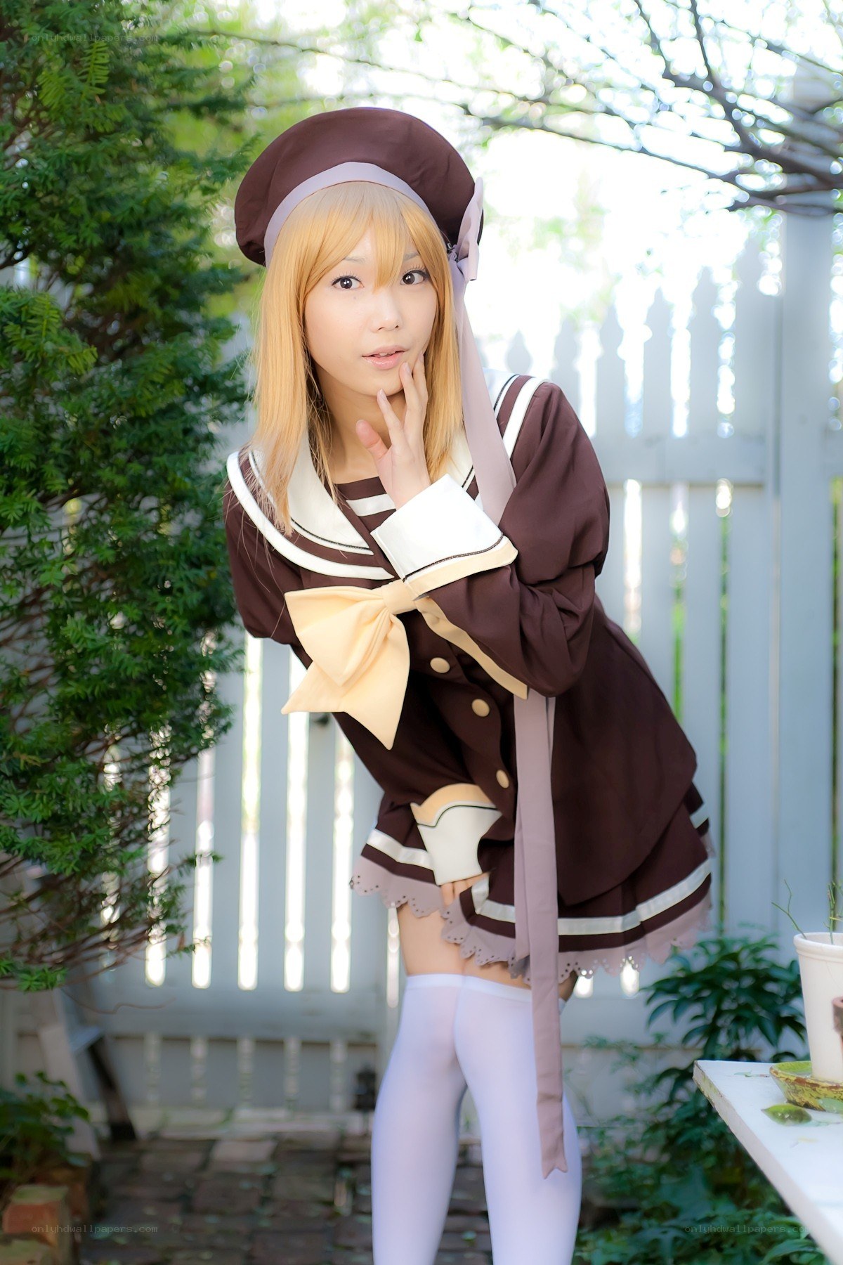 cosplayer in brown uniform
