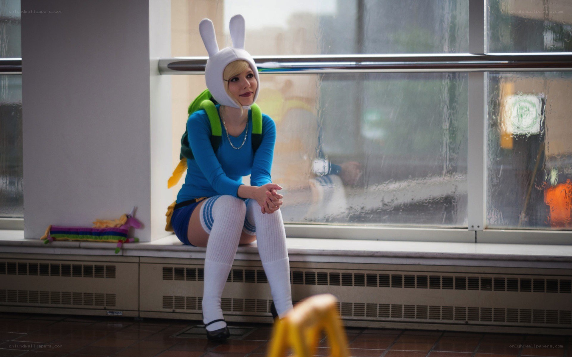 cosplayer in bunny hat by window