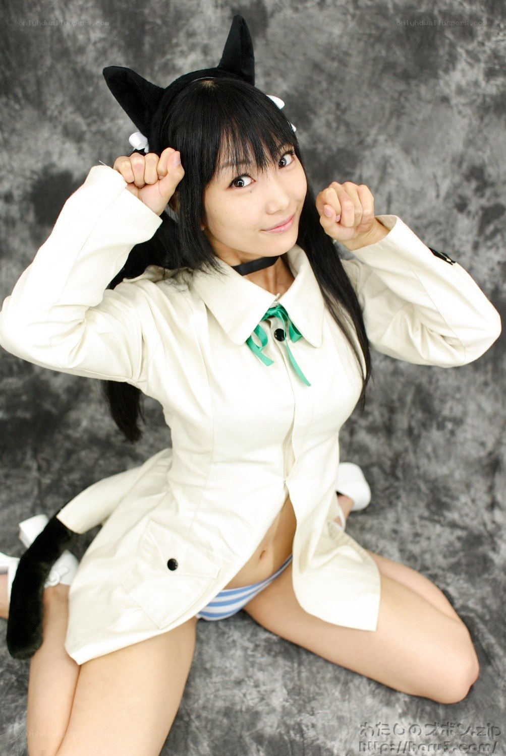 cosplayer in cat ears and white coat