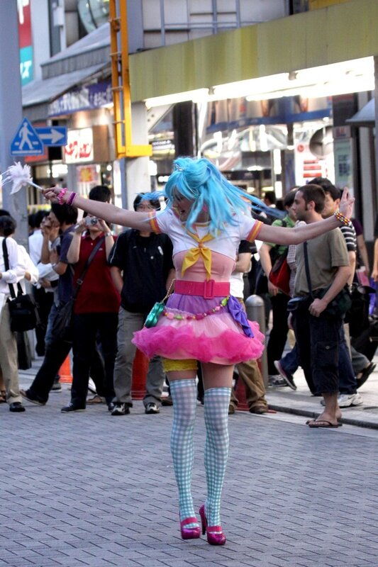 Cosplayer in colorful outfit on street