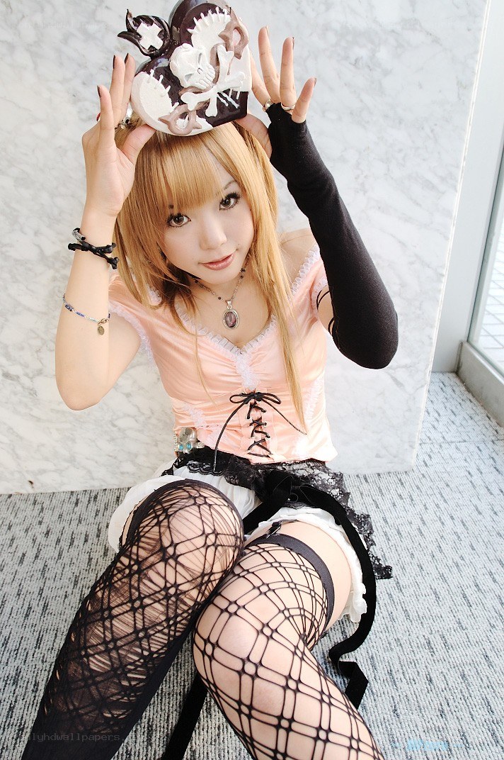 cosplayer in fishnet stockings
