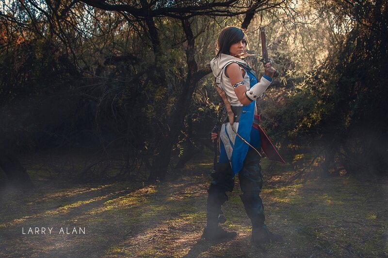 cosplayer in forest with gun
