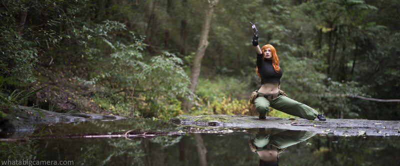 cosplayer in forest with weapon