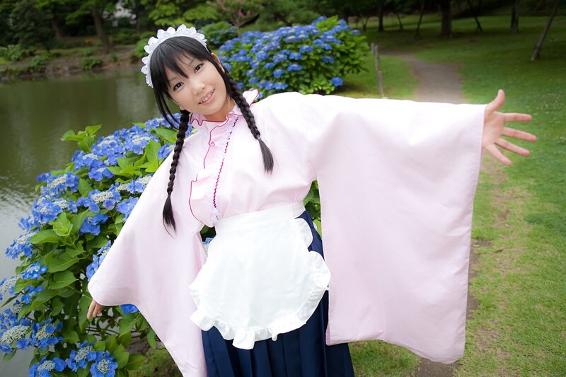 Cosplayer in garden with hydrangeas