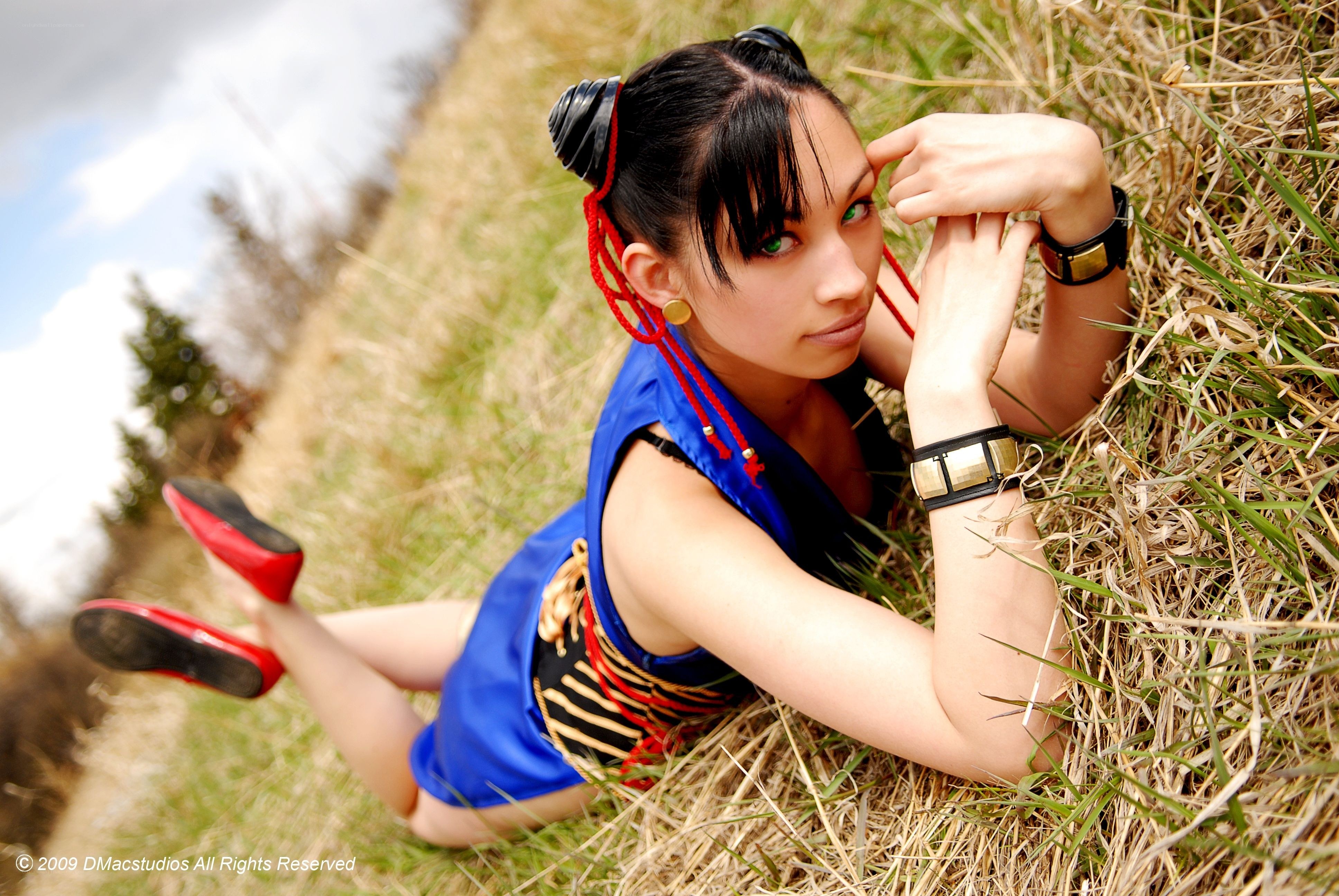 cosplayer in grassy field