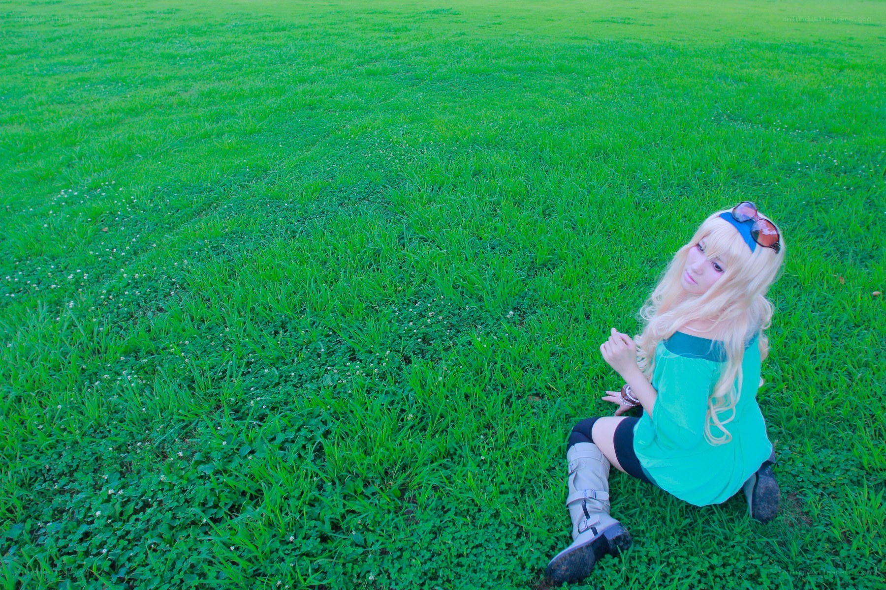 cosplayer in green field