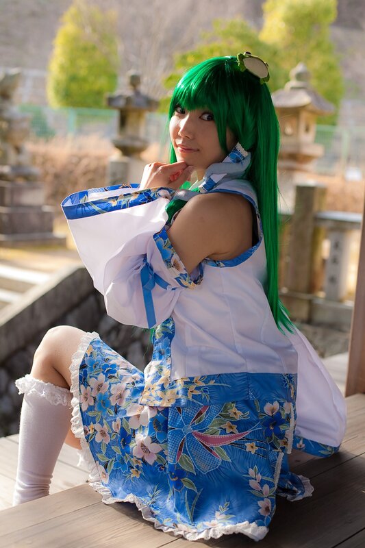 cosplayer in green wig and floral dress
