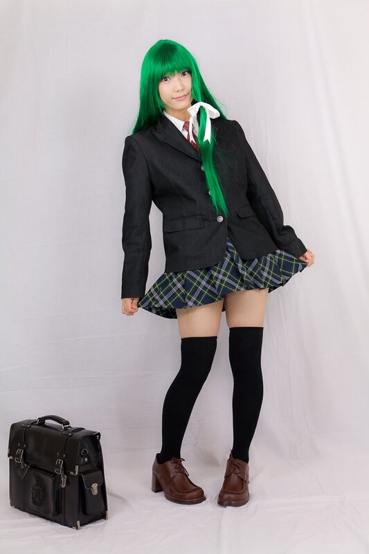 cosplayer in green wig and school uniform