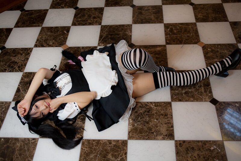 cosplayer in maid outfit