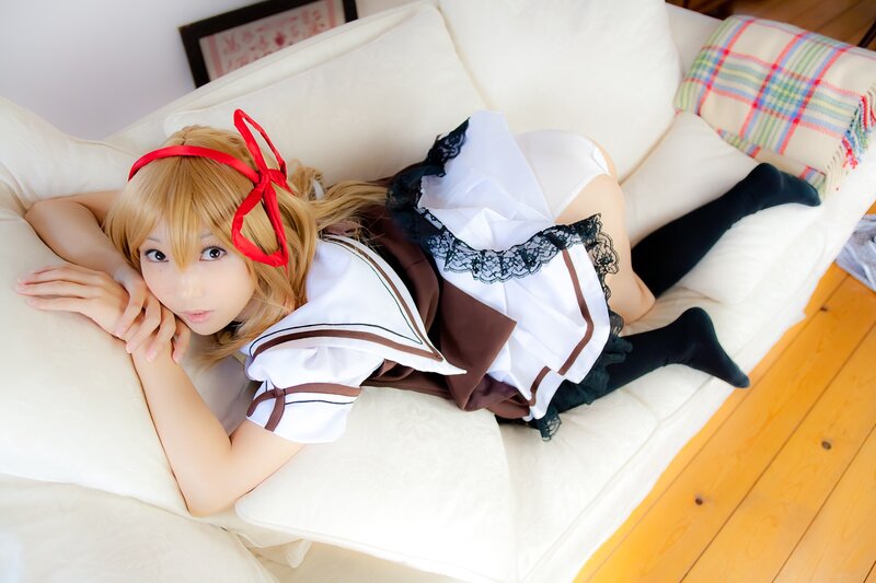 cosplayer in maid outfit on couch