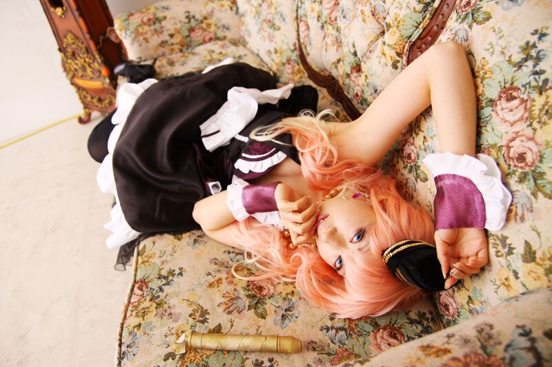 cosplayer in maid outfit on sofa