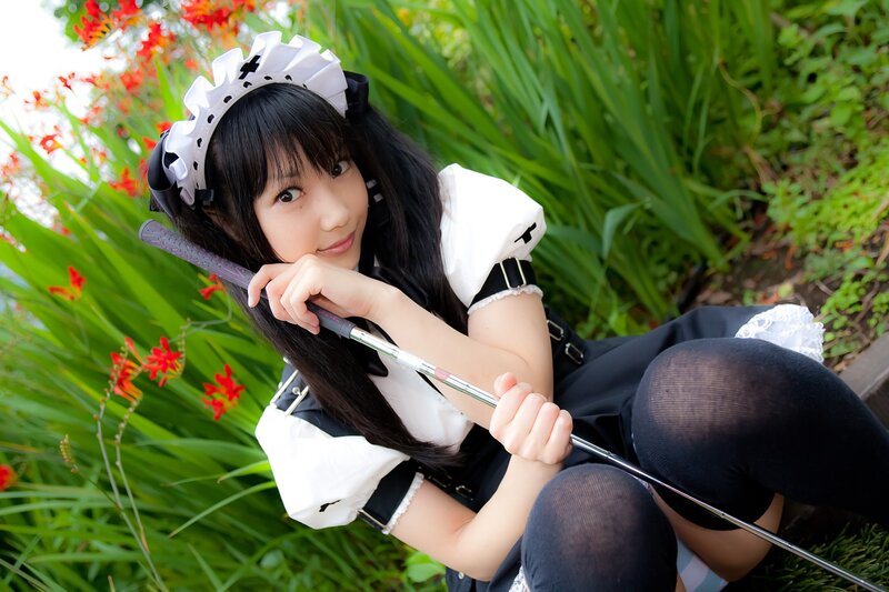 cosplayer in maid outfit outdoors