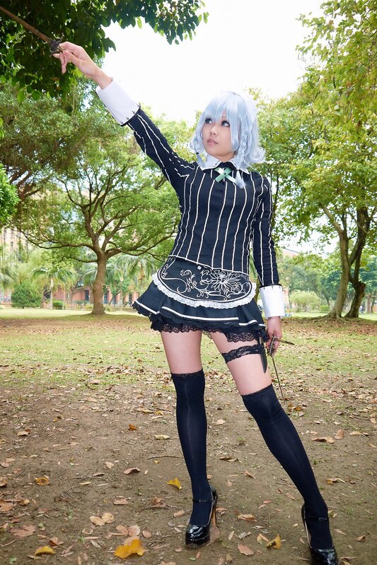 cosplayer in maid outfit outdoors