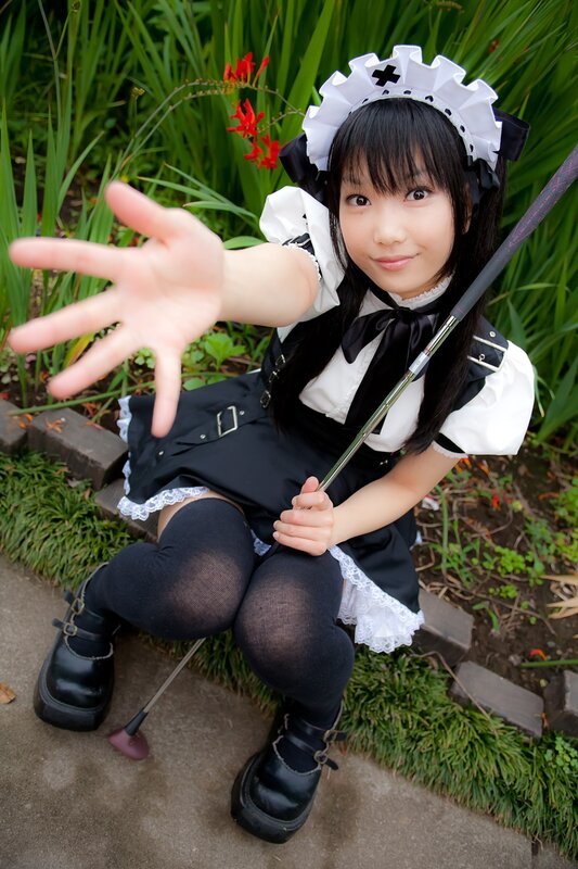 cosplayer in maid outfit outdoors
