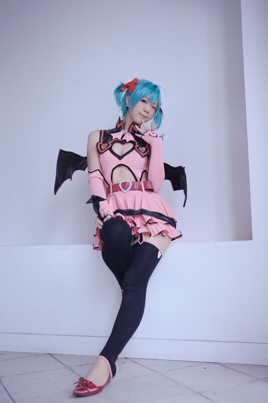cosplayer in pink and black costume