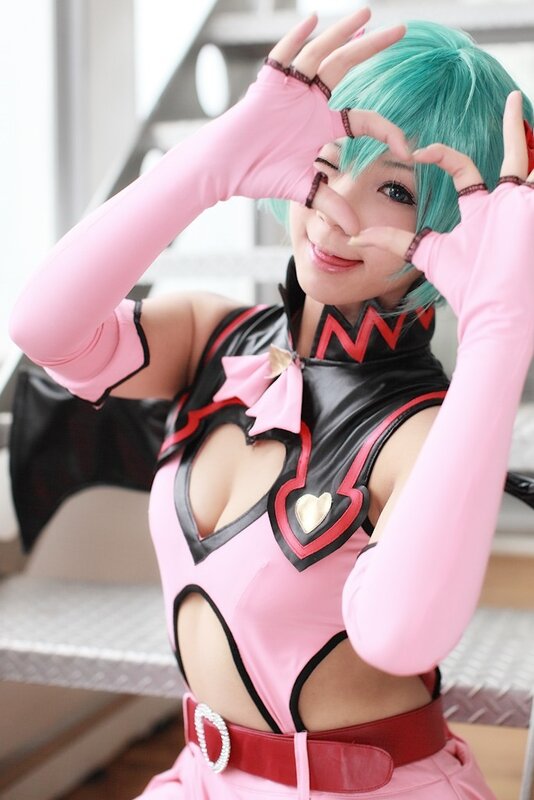 cosplayer in pink and black costume