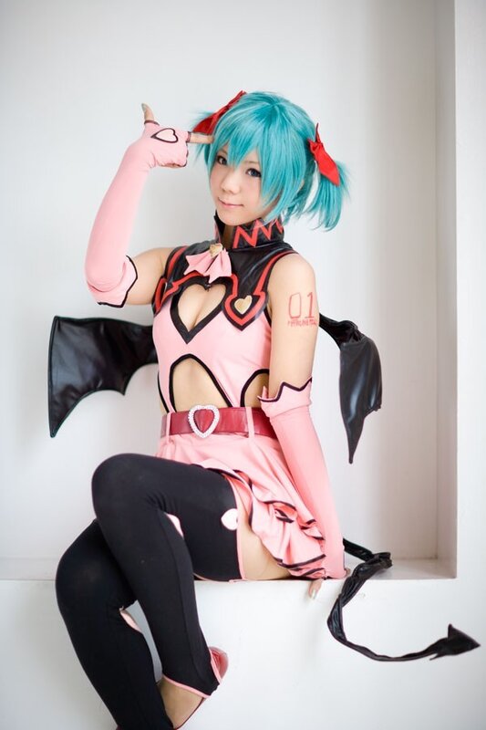 cosplayer in pink and black costume